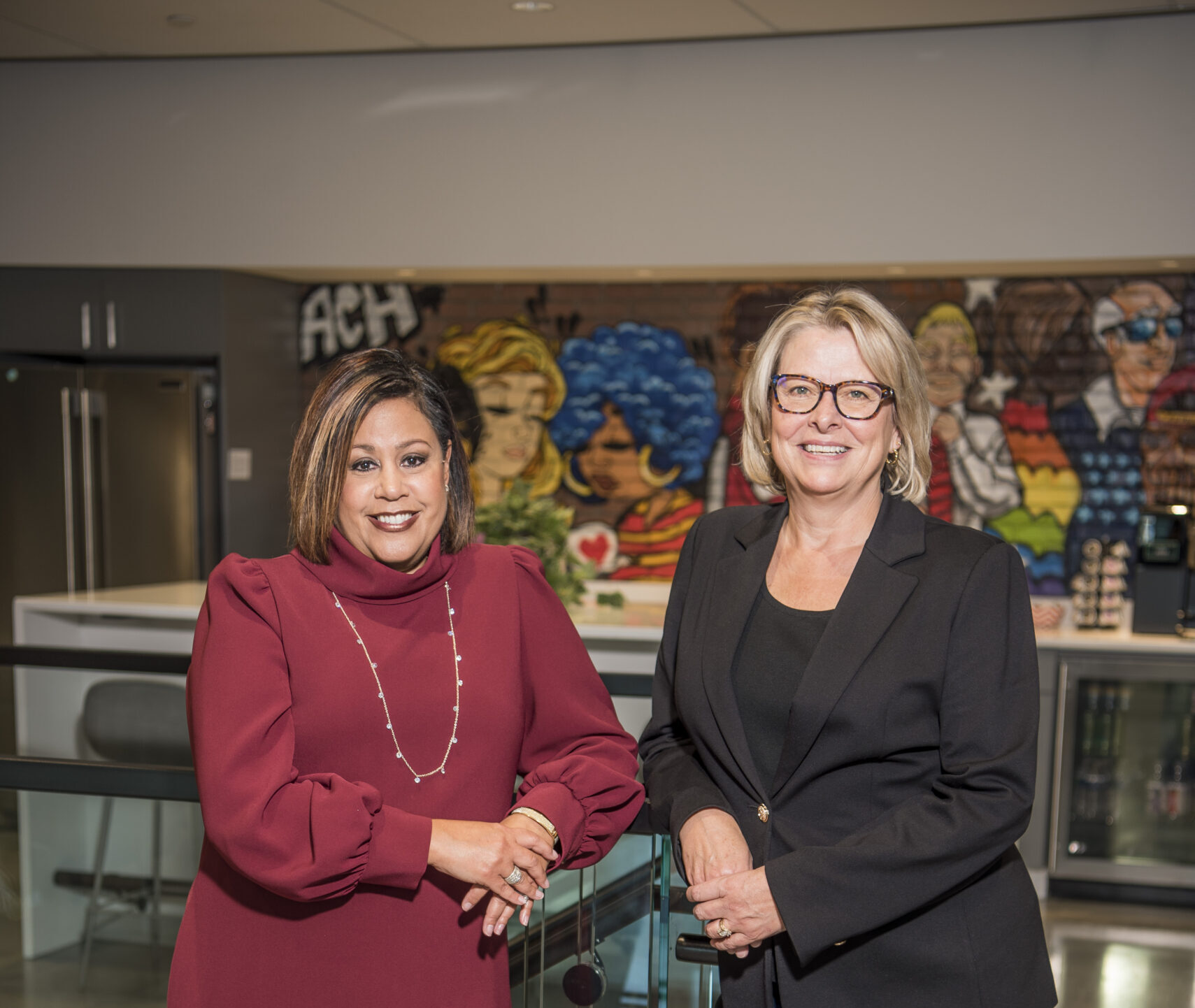 Brenda Sharpe and Carla Gibson in REACH office